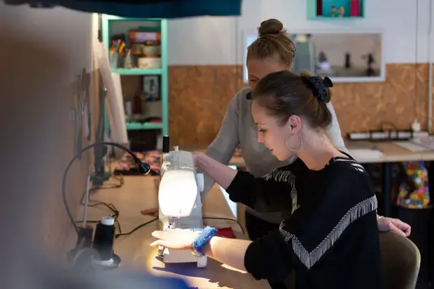 two women and sewing machine